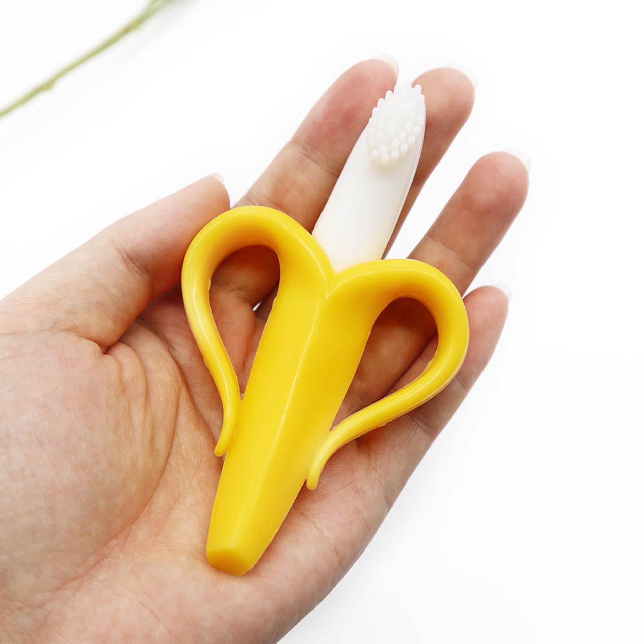 Banana shaped silicone molar teether with handles perfect for teething babies