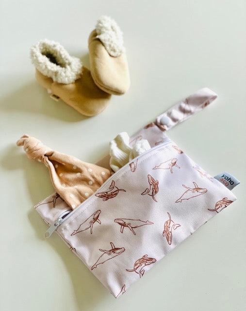 Yoho Baby & co. NZ Wet bags in 4 convenient sizes, for babies daycare, swim nappy, cloth nappies, snacks, breast pads and so much more! Toffee Whales Print